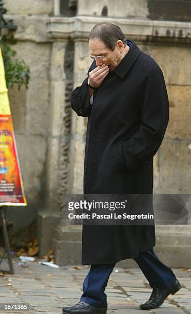 French director Robert Hossein attends the funeral services for French actor Daniel Gelin December 4, 2002 in Paris. Gelin, known best to English...