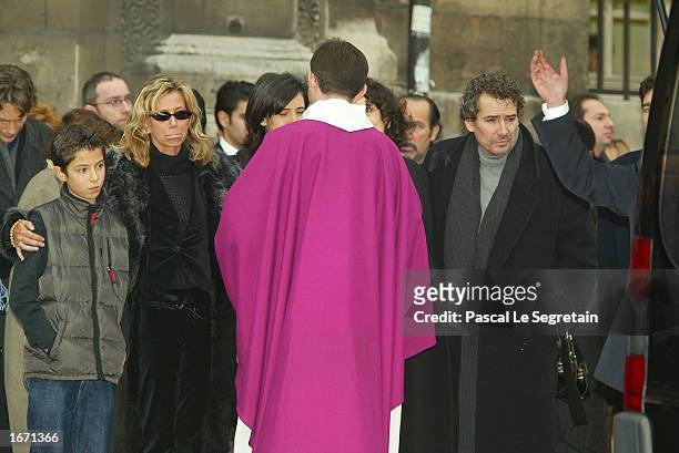 Familly members of Daniel Gelin, his Dauther Fiona , with her son, and his son Manuel , attend the funeral services for their father French actor...