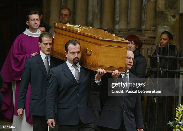 The coffin of French actor Daniel Gelin leaves the Church of St Germain Des Pres after his funeral services December 4, 2002 in Paris. Gelin, known...