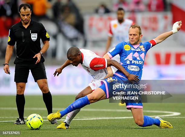 Evian's French midfielder Olivier Sorlin with Nancy's Cameroonian forward Paul Alo'o Efoulou during their French L1 football match Nancy vs Evian at...