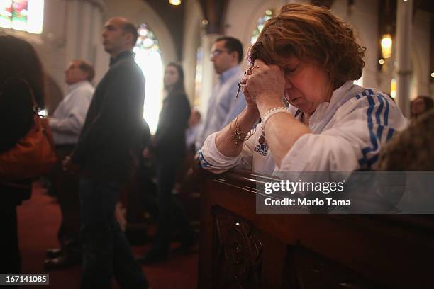 Nurse practitioner Maureen Quaranto , who treated victims of the Boston Marathon bombings in Tent A, wears her Boston Marathon jacket while praying...