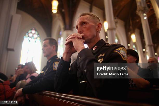 Boston Police Department Superintendents William Evans and Kevin Buckley attend Mass at the Cathedral of the Holy Cross on the first Sunday after the...
