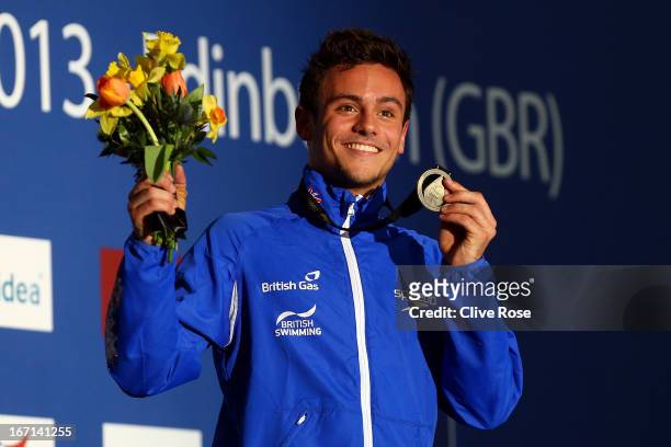 Tom Daley of Great Britain poses with his Gold medal on the podium after winning the Men's 10m Platform Final during day three of the FINA/Midea...