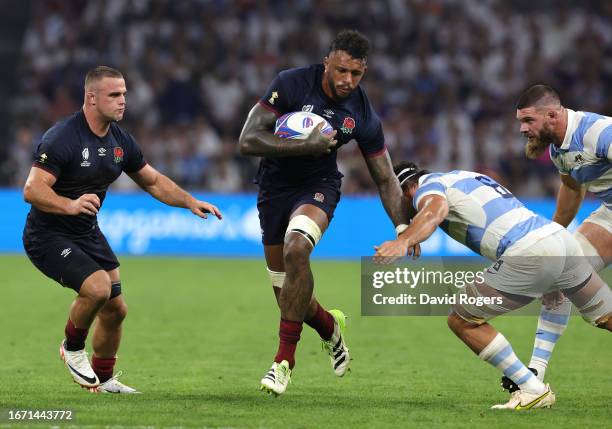 Courtney Lawes of England is tackled by Pablo Matera during the Rugby World Cup France 2023 Group D match between England and Argentina at Stade...
