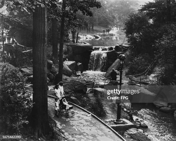 High-angle view of walkways offering pedestrians alternate views of one of three waterfalls in Bronx Park in the Bronx borough of New York City, New...