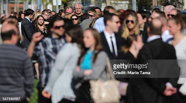 People wait on line to attend the wake for 29-year-old Krystle Campbell who was one of three people killed in the Boston Marathon bombings on April...