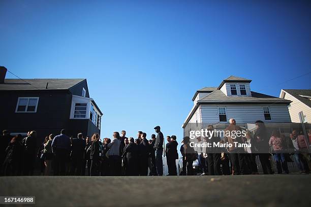 People wait on line to attend the wake for 29-year-old Krystle Campbell who was one of three people killed in the Boston Marathon bombings on April...