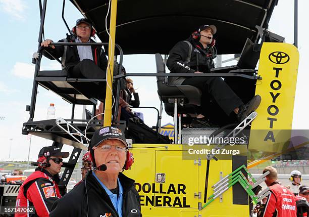 Team owner Joe Gibbs looks on as Matt Kenseth, driver of the The Home Depot/Husky Toyota, races to win the NASCAR Sprint Cup Series STP 400 at Kansas...