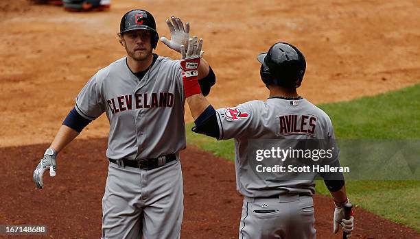 Mark Reynolds and Mike Aviles of the Cleveland Indians celebrate after Reynolds hits a home run in the seventh inning against the Houston Astros at...