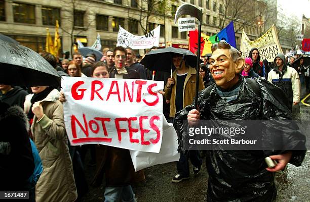 Student wearing a mask of British Prime Minister Tony Blair participates in a demonstration December 4, 2002 in London, England. Thousands of...