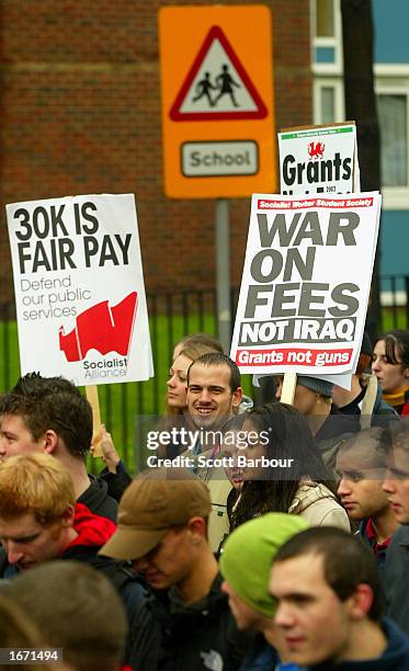 Students holding placards participate in a demonstration December 4, 2002 in London, England. Thousands of students marched through the streets of...