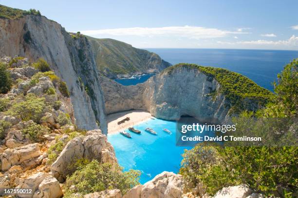 view from clifftop, navagio bay, zakynthos, greece - grecia europa del sur fotografías e imágenes de stock