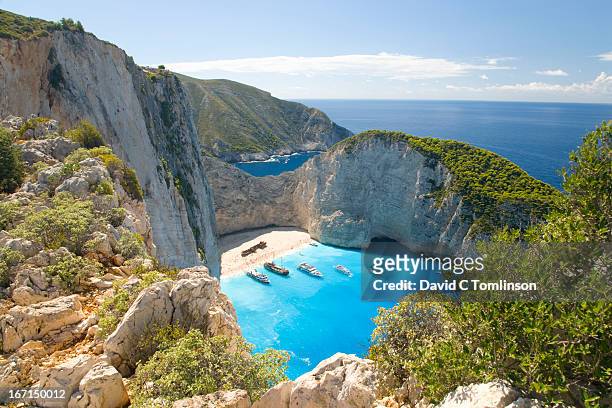 view from clifftop, navagio bay, zakynthos, greece - greece stock pictures, royalty-free photos & images