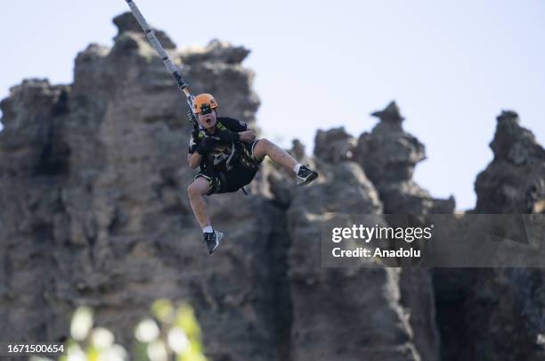 Boy jumps off a 70-metre high cliff at the Inonu caves, under the guidance of the RJTurkey team who are engaged with rope jumping since 2012, using...