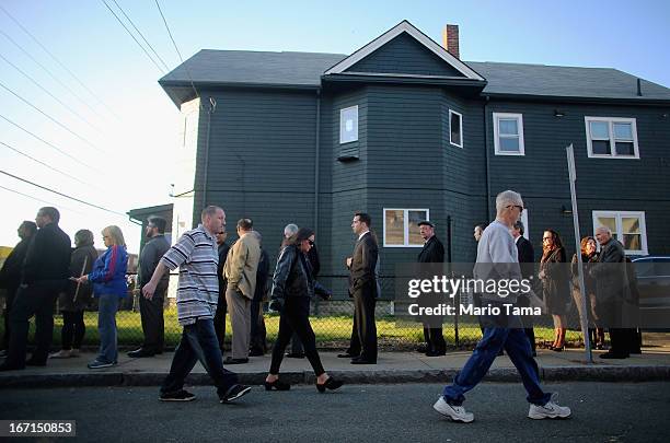 People wait on line to attend the wake for 29-year-old Krystle Campbell who was one of three people killed in the Boston Marathon bombings on April...