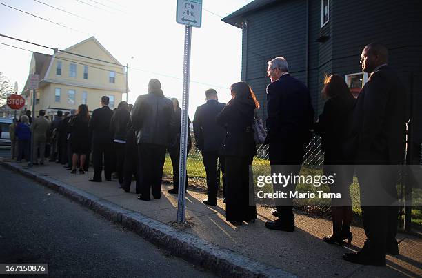 People wait on line to attend the wake for 29-year-old Krystle Campbell who was one of three people killed in the Boston Marathon bombings on April...