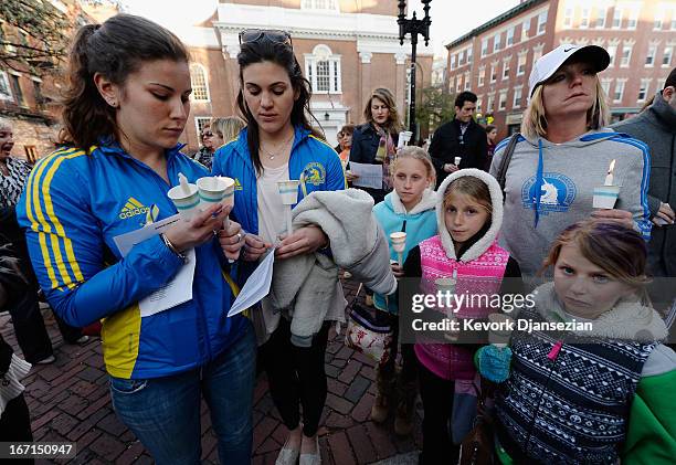 People participate in a candelight vigil for victims of Boston Marathon bombings on April 21, 2013 in Boston, Massachusetts. A manhunt for Dzhokhar...