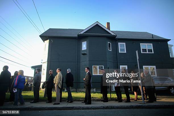 People wait on line to attend the wake for 29-year-old Krystle Campbell who was one of three people killed in the Boston Marathon bombings on April...