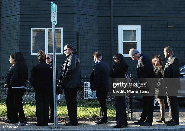 People wait on line to attend the wake for 29-year-old Krystle Campbell who was one of three people killed in the Boston Marathon bombings on April...