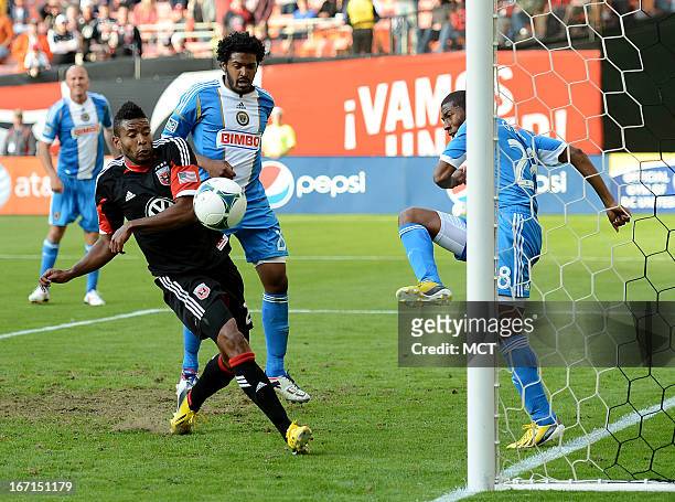 Philadelphia Union defender Raymon Gaddis , right, clears his save on the goal line against D.C. United forward Lionard Pajoy , left, in the second...