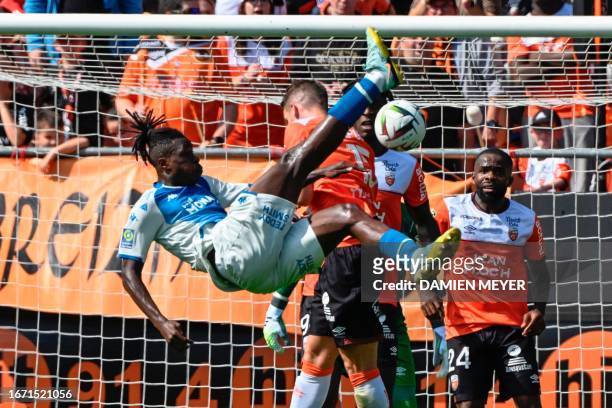 Monaco's Ivorian defender Wilfried Singo attempts a bicycle kick during the French L1 football match between FC Lorient and AS Monaco at Stade du...