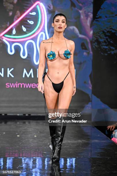 Model walks the runway wearing Pinkmelon Swimwear during New York Fashion Week Powered by Art Hearts Fashion at The Angel Orensanz Foundation on...