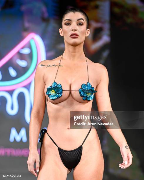 Model walks the runway wearing Pinkmelon Swimwear during New York Fashion Week Powered by Art Hearts Fashion at The Angel Orensanz Foundation on...