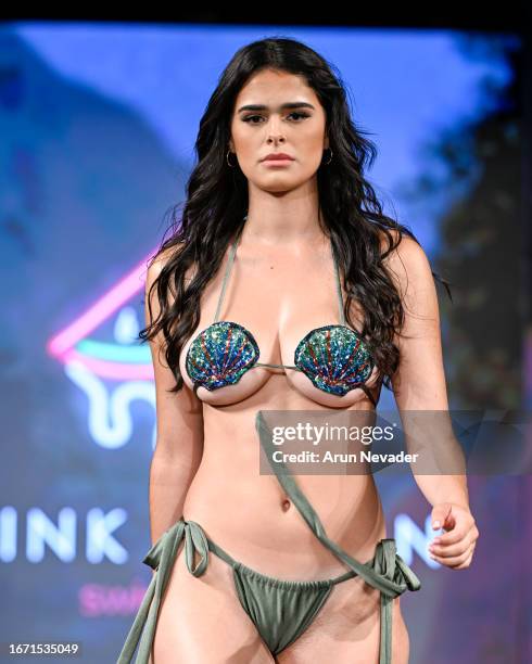 Model walks the runway wearing Pinkmelon Swimwear during New York Fashion Week Powered by Art Hearts Fashion at The Angel Orensanz Foundation on...