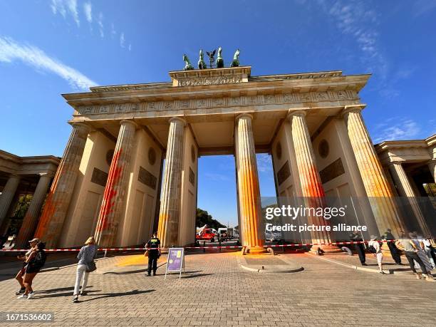 Dpatop - 17 September 2023, Berln, Berlin: Members of the climate protection group Last Generation have sprayed the Brandenburg Gate in Berlin with...