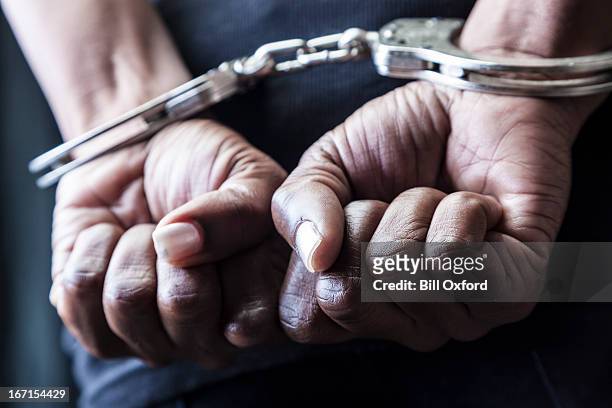 handcuffed - arresto foto e immagini stock