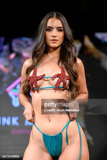 Model walks the runway wearing Pinkmelon Swimwear during New York Fashion Week Powered by Art Hearts Fashion at The Angel Orensanz Foundation on...