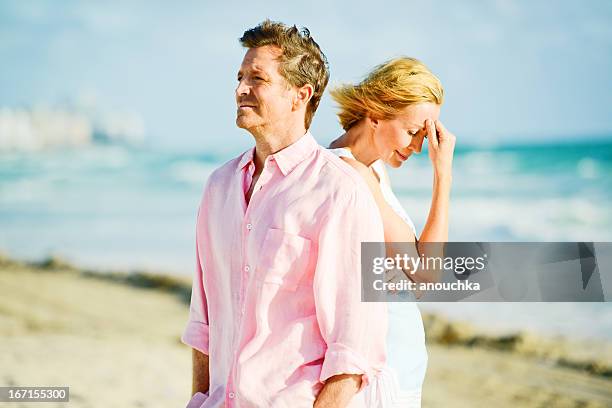 mature couple having difficult relationship - midlife crisis stock pictures, royalty-free photos & images