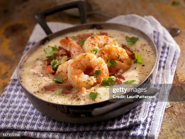 shrimp and grits - iron bowl stock pictures, royalty-free photos & images