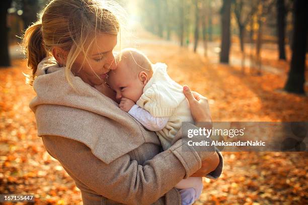 mother and a baby - beautiful blonde babes stock pictures, royalty-free photos & images