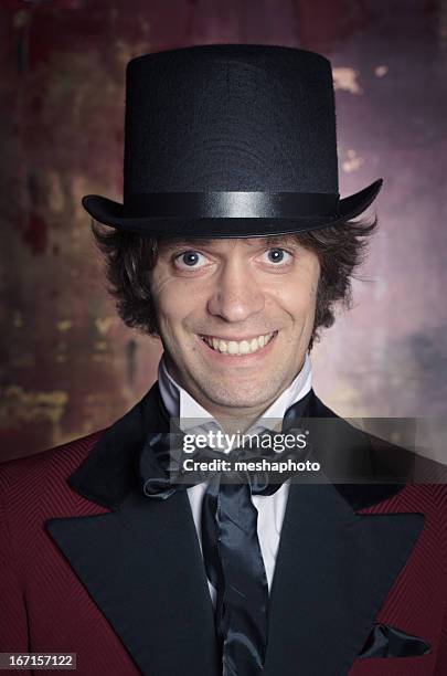 sophisticated and classy looking man in a top hat - top hat stock pictures, royalty-free photos & images