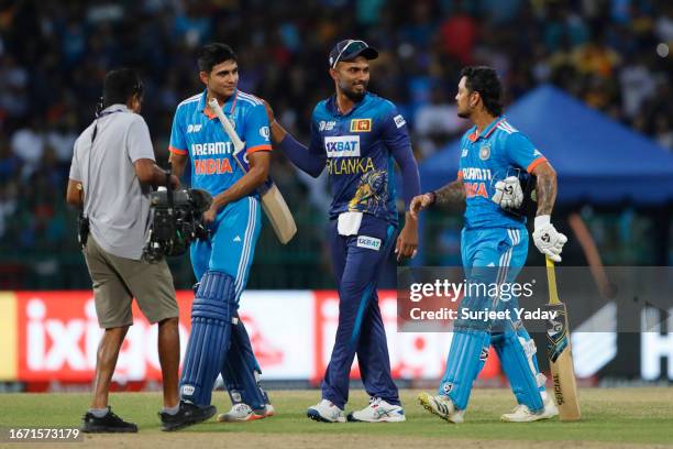 Shubman Gill of India , Dasun Shanaka of Sri Lanka and Ishan Kishan of India after win the match during the Asia Cup Final match between India and...