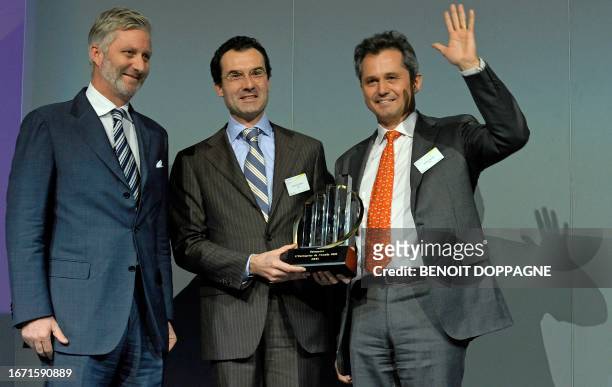 Prince Philippe of Belgium and co-founders and directors of EXKi Nicolas Steisel and Frederic Rouvez handel their award at the of the 15th edition of...