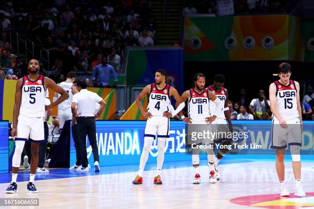 Mikal Bridges, Tyrese Haliburton, Jalen Brunson, Anthony Edwards and Austin Reaves of the United States react in overtime during the FIBA Basketball...