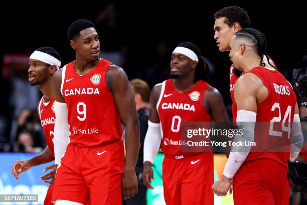 Shai Gilgeous-Alexander, RJ Barrett, Luguentz Dort, Dwight Powell and Dillon Brooks of Canada celebrate after the FIBA Basketball World Cup 3rd Place...