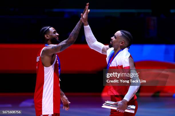 Nickeil Alexander-Walker and Dillon Brooks of Canada celebrate with their bronze medals after the FIBA Basketball World Cup 3rd Place game victory...