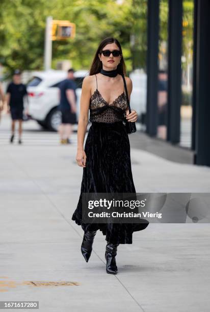 Illirida Krasniqi wears transparent top, black skirt, bag, boots outside Bevza on September 09, 2023 in New York City.