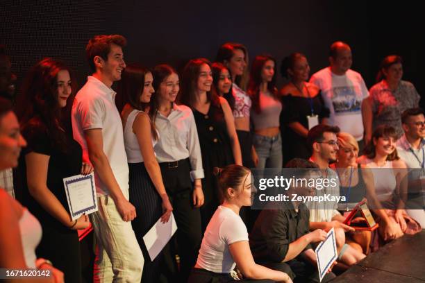 taking selfies at certificate ceremony on stage - lgbt awards stockfoto's en -beelden