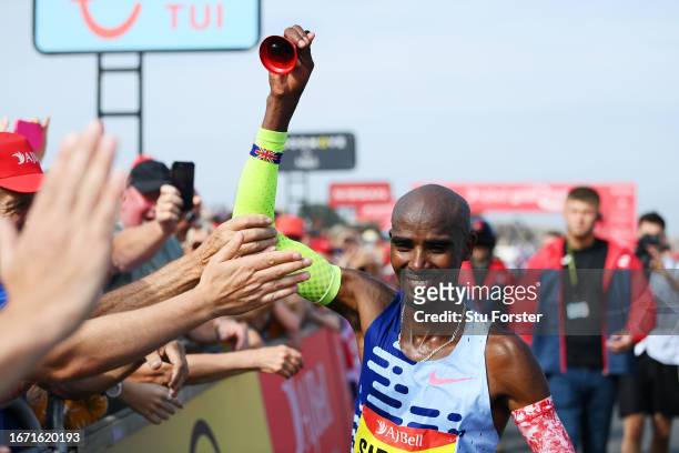 Sir Mo Farah of Great Britain interacts with spectators after his run in the Elite Men race during the AJ Bell Great North Run 2023 on September 10,...