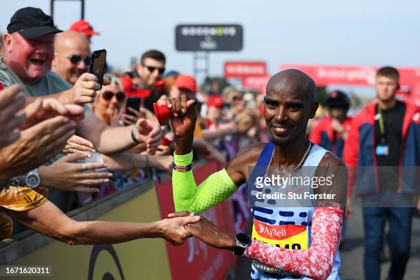 Sir Mo Farah of Great Britain interacts with spectators after his run in the Elite Men race during the AJ Bell Great North Run 2023 on September 10,...