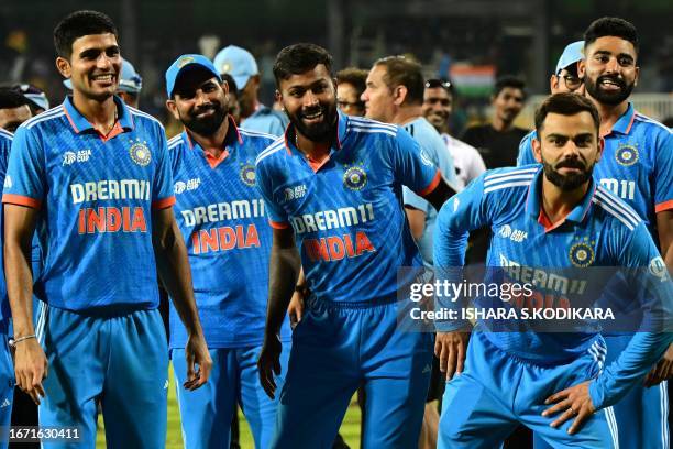 India's Shubman Gill, Mohammed Shami, Hardik Pandya, Virat Kohli and Mohammed Siraj pose after their team's win at the end of the Asia Cup 2023...