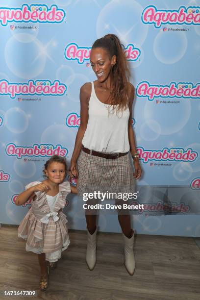 Guest and Judi Shekoni attend the launch of Aquabeads at Covent Garden Town House Salon on September 17, 2023 in London, England.