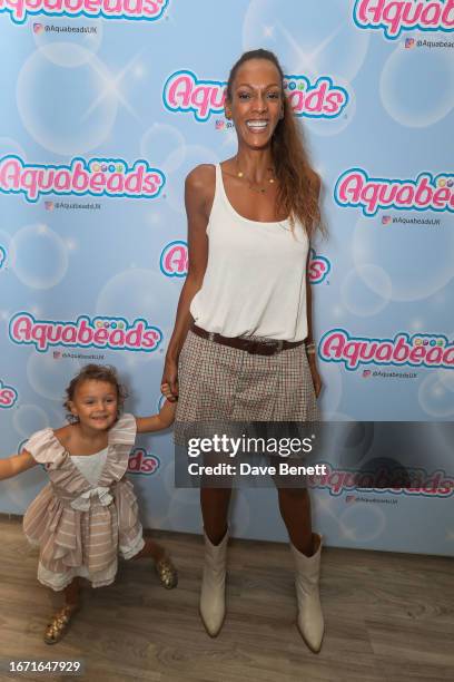 Guest and Judi Shekoni attend the launch of Aquabeads at Covent Garden Town House Salon on September 17, 2023 in London, England.
