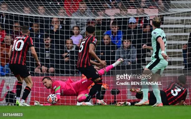 Bournemouth's Brazilian goalkeeper Neto saves a shot from Chelsea's English midfielder Conor Gallagher during the English Premier League football...