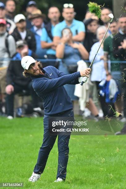 England's Tommy Fleetwood plays from the rough on the 3rd hole on day four of the BMW PGA Championship at Wentworth Golf Club, south-west of London,...