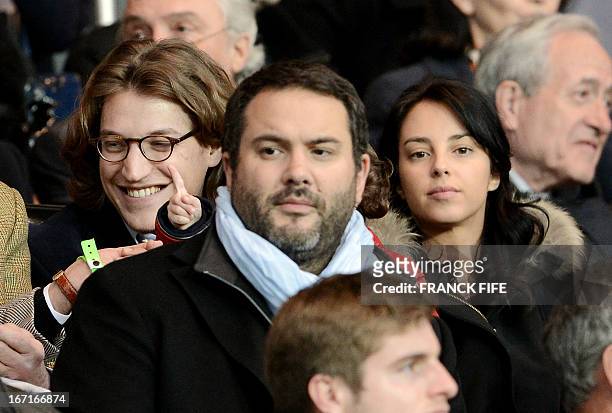Jean Sarkozy , the son of Former French president, and his wife Jessica Sebaoun-Darty , are pictured behind French journalist Bruce Toussaint before...